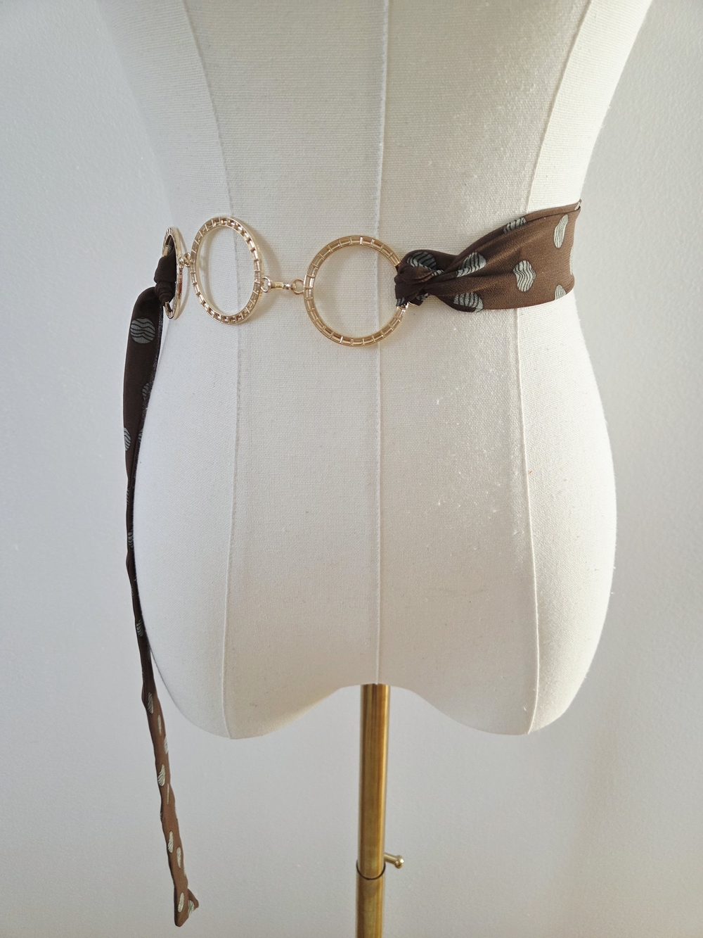Brown and mint green polka dot scarf belt with gold circular accents